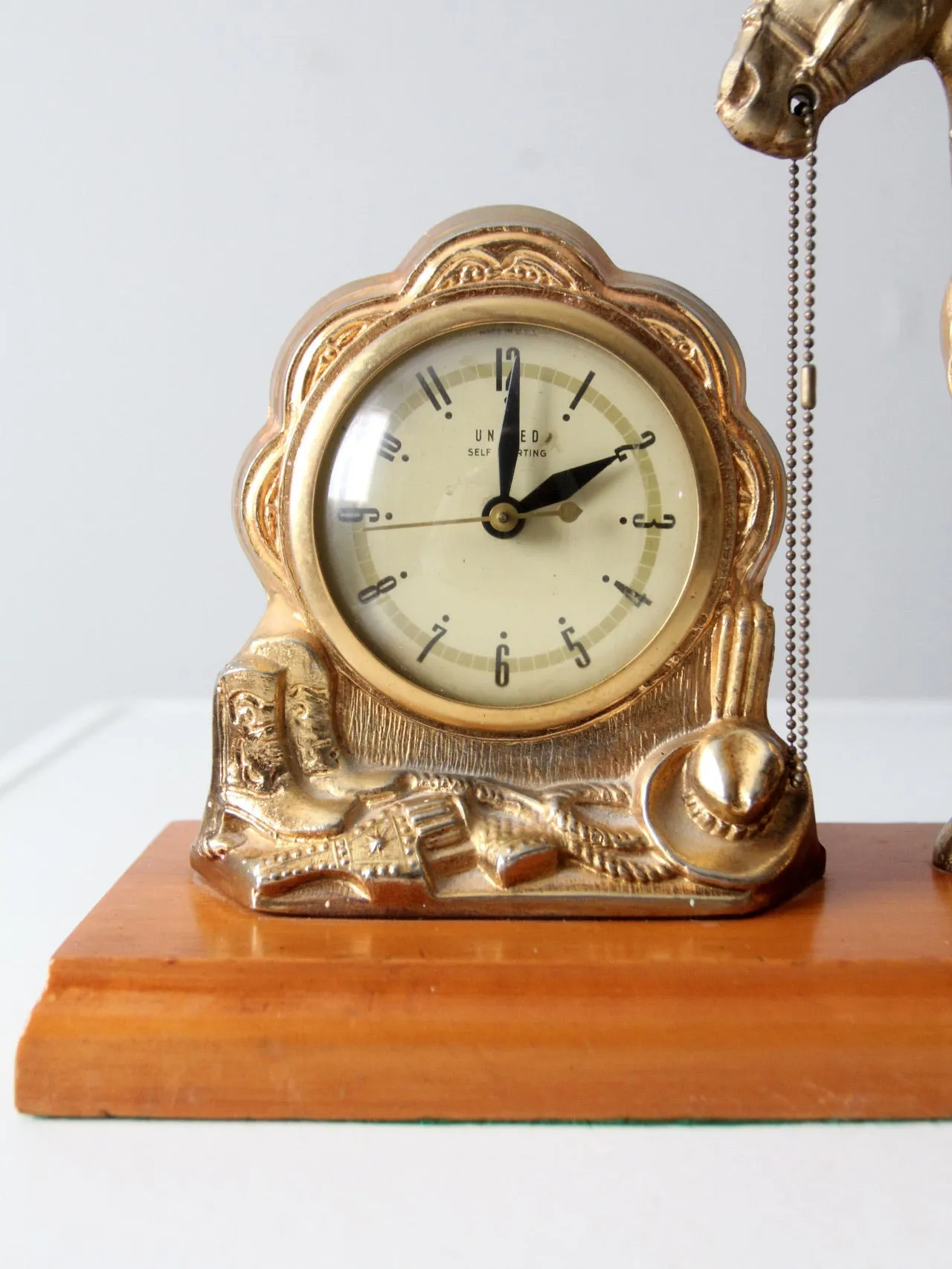 mid century United self-starting horse clock